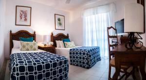 Costa Caribe Hotel Beach & Resort客房内的一张或多张床位