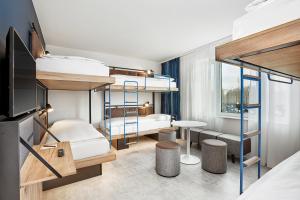 H2 Hotel München Olympiapark客房内的一张或多张床位