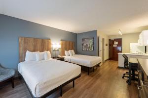 美洲长期住宿酒店 - 夏洛特 - 派恩维尔 - 公园路客房内的一张或多张床位