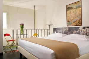 Leone Blu Suites | UNA Esperienze客房内的一张或多张床位