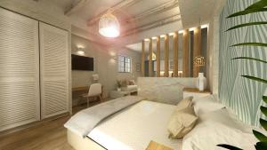 Aeolia suites客房内的一张或多张床位