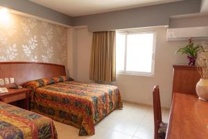 Hotel Impala -Atras del ADO客房内的一张或多张床位