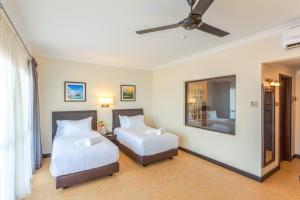 兰卡威卡马尔度假村客房内的一张或多张床位