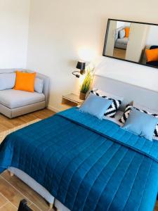 Aquamarina Onyx Blue客房内的一张或多张床位