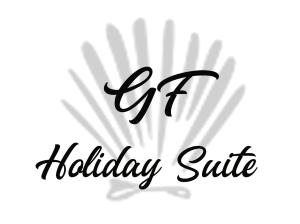 瓦拉泽GF Holiday Suite的黑书法文字节日对白底的打击