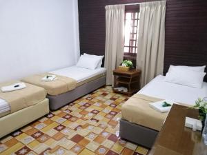 AsiaCamp Taman Negara Resort客房内的一张或多张床位