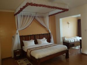 Esikar Gardens Hotel客房内的一张或多张床位