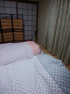 Japanese Style Inn Dohzen Miwa客房内的一张或多张床位