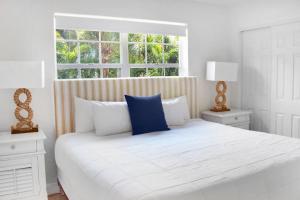 Suites at Coral Resorts客房内的一张或多张床位