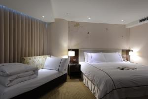 柯达大饭店 台北敦南客房内的一张或多张床位