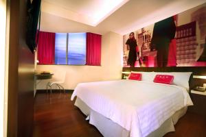 favehotel MEX Tunjungan Surabaya客房内的一张或多张床位