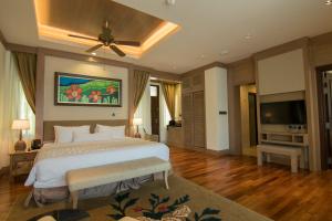 Royale Chulan Cherating Villa客房内的一张或多张床位
