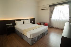 赛日马来西亚斯昂盖皮塔尼酒店客房内的一张或多张床位