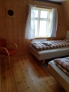 Brjánslækur Gamli bærinn客房内的一张或多张床位