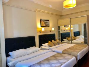 塔克西姆公寓式酒店客房内的一张或多张床位
