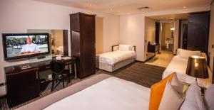 乌姆赫兰加海岸酒店及会议中心客房内的一张或多张床位
