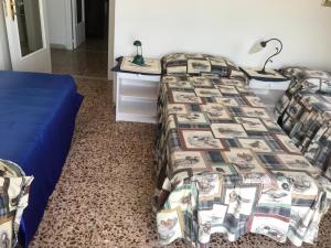 Favoloso Attico sul Mare客房内的一张或多张床位