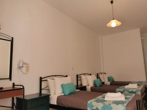 爱琴海酒店客房内的一张或多张床位