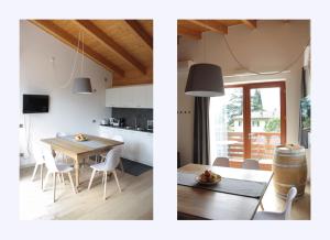加尔达湖滨San Giacomo Apartments的厨房以及带桌子的用餐室。