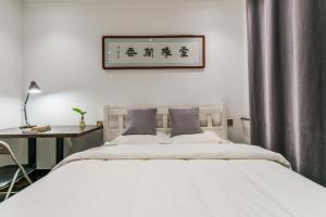 西安古城墙下您舒适的家客房内的一张或多张床位