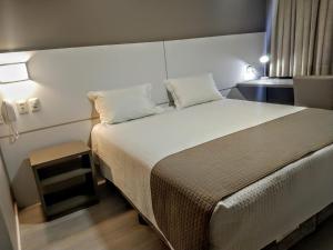 Tri Hotel Executive Indaial客房内的一张或多张床位