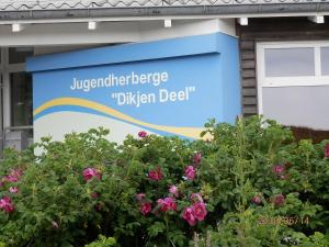 韦斯特兰Jugendherberge Westerland的花房前的标志