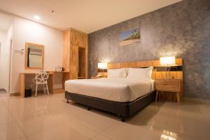 Adya Hotel Chenang客房内的一张或多张床位