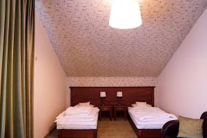 缅济热奇尼欧酒店客房内的一张或多张床位