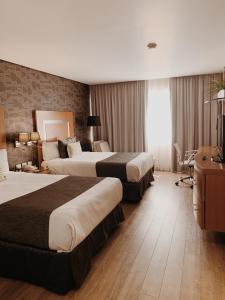 水星酒店客房内的一张或多张床位