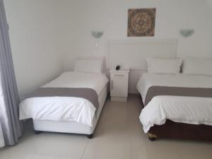 Royal Ushaka Durban North客房内的一张或多张床位
