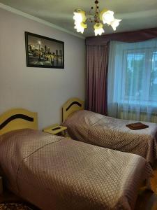 Zubkovskiy Hotel客房内的一张或多张床位