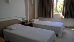 Hotel Rio Grande客房内的一张或多张床位