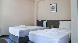 Hotel Premium客房内的一张或多张床位