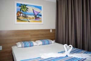 马塞约Sun Paradise - JTR的卧室配有一张挂在墙上的床铺