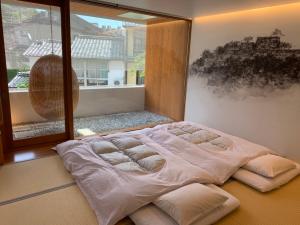 UTSUROI Tsuchiya Annex客房内的一张或多张床位