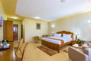 Kilimo Grand Resort客房内的一张或多张床位