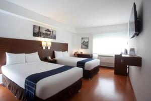 卡萨安迪纳米拉弗洛雷斯选择酒店客房内的一张或多张床位