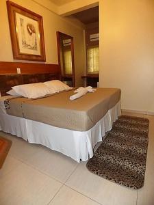 普萨达松豪梅佛兹酒店客房内的一张或多张床位