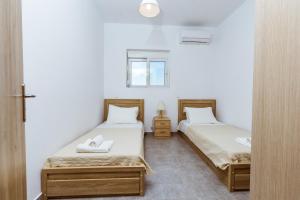 Martimi Apartments - 200M from Drapanias Beach - Pool - Hot Tub - Sauna - BBQ客房内的一张或多张床位