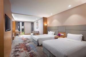 北京明豪华美达酒店（原北京明豪戴斯酒店）客房内的一张或多张床位