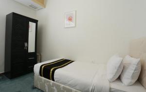 Dahlia Apartments Riggae客房内的一张或多张床位