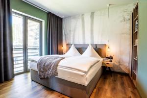 EchtZeit - Dein Hotelquartier客房内的一张或多张床位