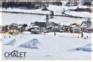 利维尼奥Chalet Goloseria的积雪中一群建筑物,与城镇同在