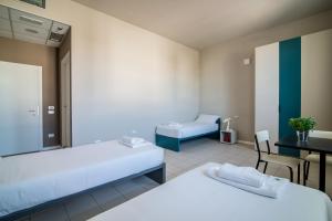 Casa a Colori Padova客房内的一张或多张床位