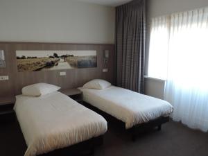 Hotel Ekamper客房内的一张或多张床位
