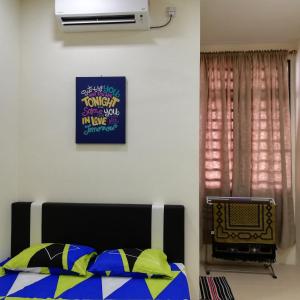 Neesa Homestay Bukit Gambang-Muslim客房内的一张或多张床位