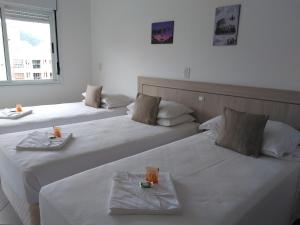 Brava Apart Hotel客房内的一张或多张床位