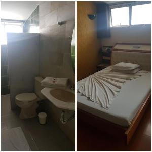 贝洛奥里藏特Sleep Suites的浴室设有床、卫生间和水槽。
