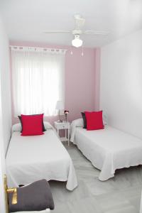 Apartamento Centro Sanlucar客房内的一张或多张床位