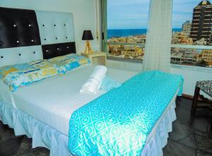 Increible Vista al mar Centro de Punta del Este客房内的一张或多张床位